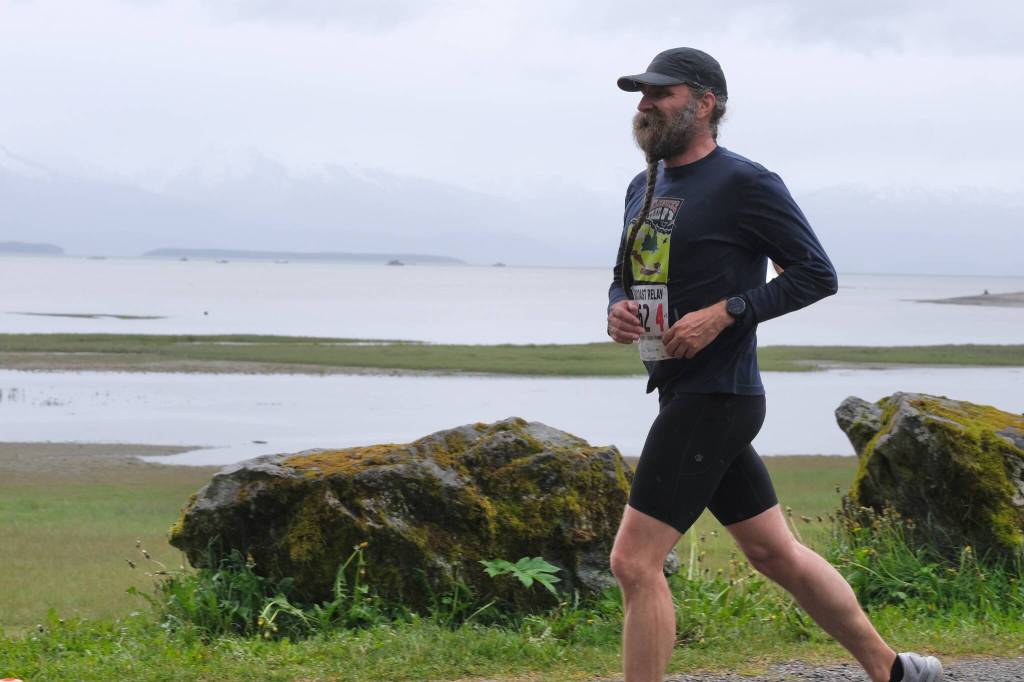 The Stragglers Eric Antrim approaches the finish line of the Seacoast Relay at the Eagle Beach State Park outer beach picnic shelter on Sunday, June 8, 2025. (Klas Stolpe / Juneau Empire)