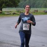 The Three Marmoteers Danielle Dunivin approaches the finish line of the Seacoast Relay at the Eagle Beach State Park outer beach picnic shelter on Sunday, June 8, 2025. (Klas Stolpe / Juneau Empire)