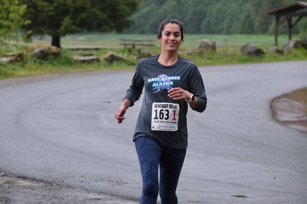 The Three Marmoteers Danielle Dunivin approaches the finish line of the Seacoast Relay at the Eagle Beach State Park outer beach picnic shelter on Sunday, June 8, 2025. (Klas Stolpe / Juneau Empire)