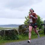 Jesse Stringer of team Mauve Dolphin Return Of The Jesse approaches the finish line of the Seacoast Relay at the Eagle Beach State Park outer beach picnic shelter on Sunday, June 8, 2025. (Klas Stolpe / Juneau Empire)