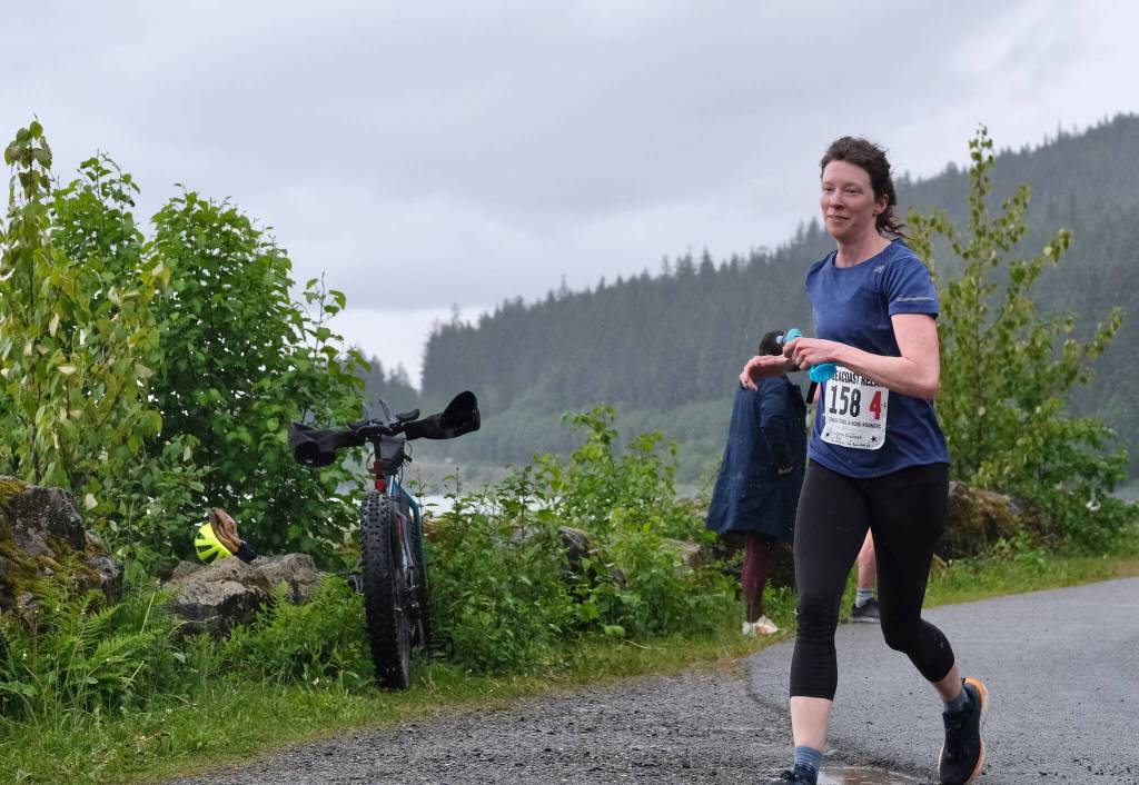 Olivia Glasscock of team Running For The Burritos approaches the finish line of the Seacoast Relay at the Eagle Beach State Park outer beach picnic shelter on Sunday, June 8, 2025. (Klas Stolpe / Juneau Empire)