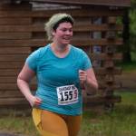 Hanna Davis of team Four Moms, One Dad approaches the finish line of the Seacoast Relay at the Eagle Beach State Park outer beach picnic shelter on Sunday, June 8, 2025. (Klas Stolpe / Juneau Empire)