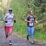 Becky Bohrer and Danielle Dunivin approach the finish of the East Glacier Trail Tangle on Tuesday. The 4.9-mile race follows part of Under Thunder Trail around East Glacier Trail and back. (Klas Stolpe / Juneau Empire)