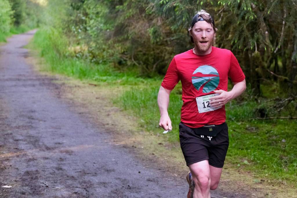 Quinn Tracy approaches the finish of the East Glacier Trail Tangle on Tuesday. The 4.9-mile race follows part of Under Thunder Trail around East Glacier Trail and back. (Klas Stolpe / Juneau Empire)