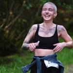 Grace Dumas approaches the finish of the East Glacier Trail Tangle on Tuesday. The 4.9-mile race follows part of Under Thunder Trail around East Glacier Trail and back. (Klas Stolpe / Juneau Empire)