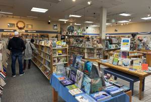 People browse at the Hearthside Books branch in the Nugget Mall on Monday, May 26, 2025. (Mark Sabbatini / Juneau Empire file photo)