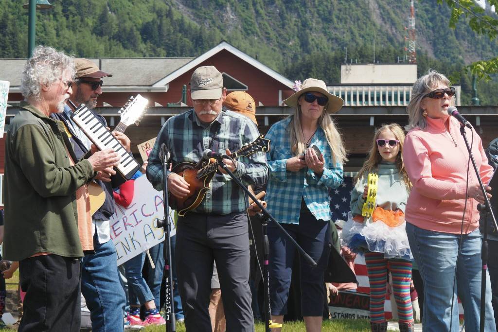 A group introduced as a bunch of concerned musicians play music at the No Kings protest on Saturday, June 14, 2025. (Natalie Buttner / Juneau Empire)