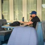 Paul Myers takes a business phone call while stopped in Haines on Tuesday, June 17, 2025. (Jasz Garrett / Juneau Empire)