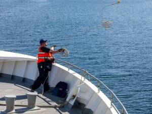 A ferry worker ties up the Hubbard on Sunday, April 21, 2024, as it docks in Haines, Alaska. (Rashah McChesney / Chilkat Valley News)