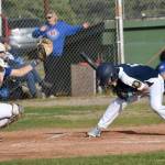 Jacob Katasse of Auke Bay Post 25 ducks under a pitch in front of catcher Conner Mitchuson of Madisonville (Kentucky) Post 6 on Friday, June 20, 2025, in the Lance Coz Wood Bat Tournament at Coral Seymour Memorial Park in Kenai, Alaska. (Photo by Jeff Helminiak/Peninsula Clarion)