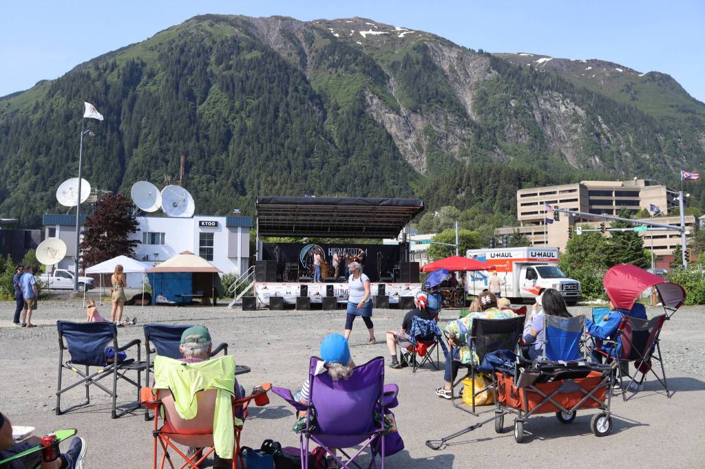 Spectators watch Nine Miles from Town perform at the Alaska Native Sisterhood Camp 70 Summer Solstice Music Festival on Saturday, June 21, 2025. (Ellie Ruel / Juneau Empire)