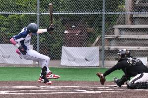 Juneaus Auke Bay Post 25 batter Noah Lewis is hit by a pitch during American Legion action against South Post 4 earlier this season. Juneau will play a home series against Palmer Post 15 Saturday through Monday at Adair Kennedy Memorial Park. (Klas Stolpe / Juneau Empire)