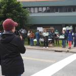 Brenda Knapp addresses demonstrators at state senators downtown offices on Friday, June 27, 2025. (Natalie Buttner / Juneau Empire)