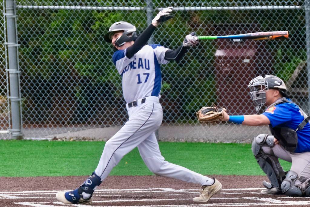 Juneaus Auke Bay Post 25 batter Kasen Ludeman (17) watches as his game winning hit against Palmer Post 15 falls into left field during Juneaus 7-6 win over Palmer in American Legion Baseball action Sunday at Adair Kennedy Memorial Park. (Klas Stolpe / Juneau Empire)