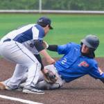 Juneaus Auke Bay Post 25 third baseman Madden Mendoza tags out Palmer Post 15 base runner Reed Craner (2) during Juneaus 7-6 win over Palmer in American Legion Baseball action Sunday at Adair Kennedy Memorial Park. (Klas Stolpe / Juneau Empire)