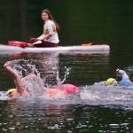 Swimmers race in Saturdays Open Water Swim Series on Auke Lake. (Klas Stolpe / Juneau Empire)