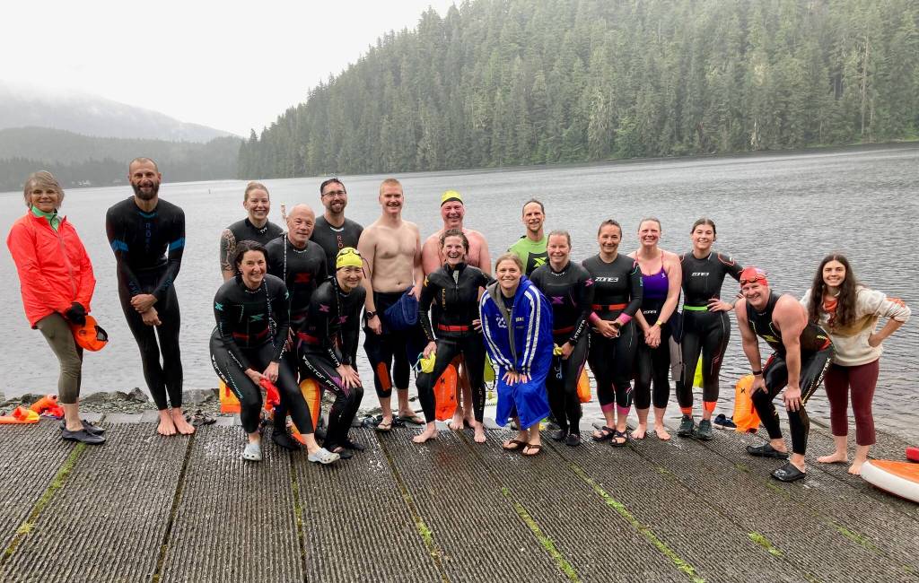 Racers pose for a photo after Saturdays third race of the Open Water Swim Series on Auke Lake. (Klas Stolpe / Juneau Empire)