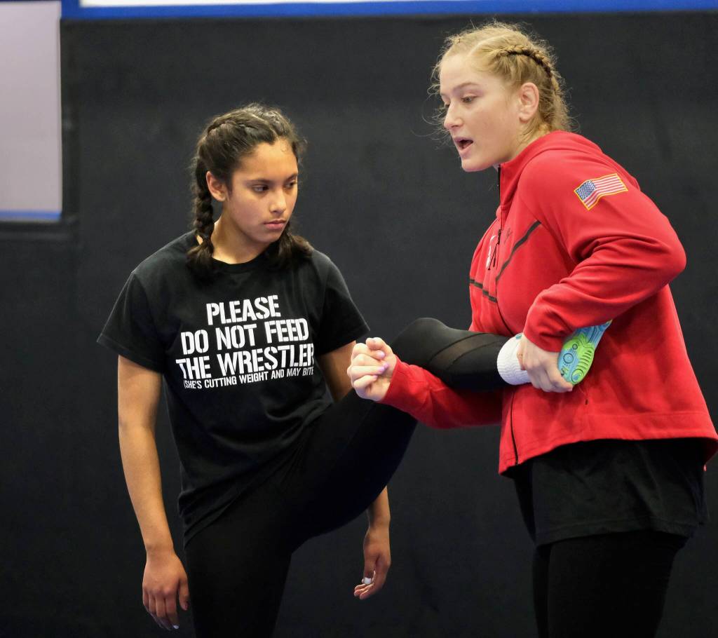 2024 Olympic wrestling gold medalist Amit Elor, 21, demonstrates a counter move on Delta Junction High School freshman Clarissa Perez, 14, during the Juneau Girls Wrestling Clinic on Wednesday at the Juneau Wrestling Center. (Klas Stolpe / Juneau Empire)