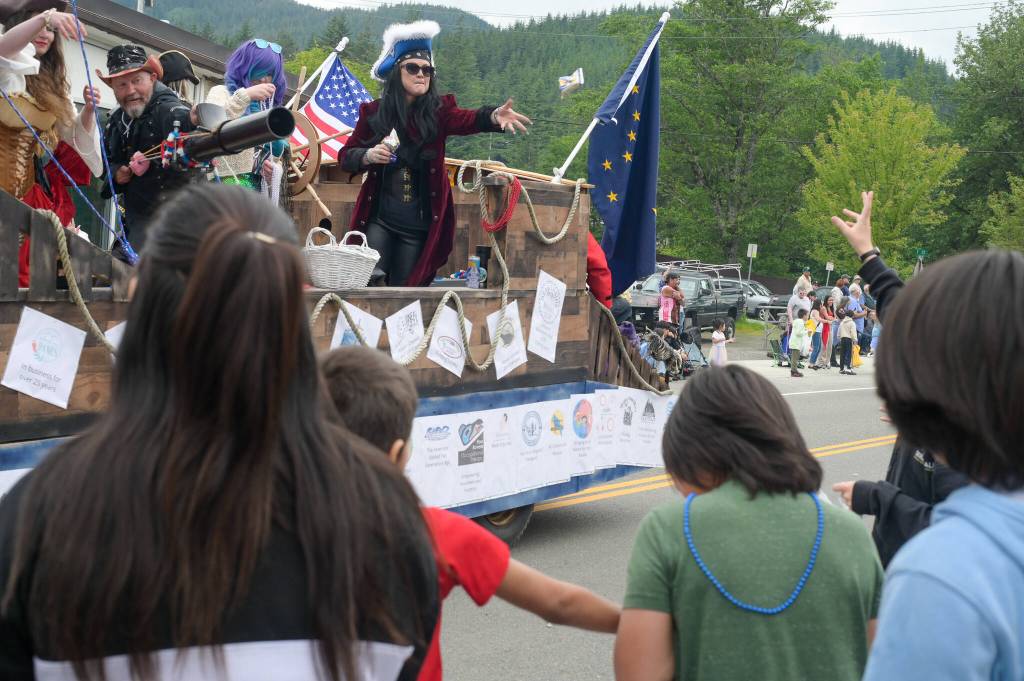 Candy is shot from a cannon on the Mendenhall Mall pirate float on Friday, July 4, 2025. (Jasz Garrett / Juneau Empire)