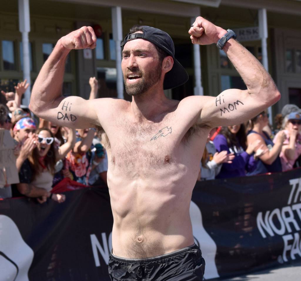 James Carlberg, 34, of Seward finishes the mens race at the Mount Marathon Race on July 4, 2025, in Seward, Alaska. (Photo by Jeff Helminiak/Peninsula Clarion)