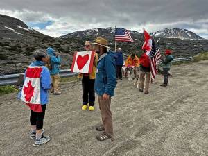 Photos by Bill Glude
About 50 people attended a rally promoting Canada-United States friendship on the international border near Skagway on July 5.