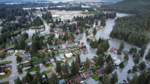 Alaska National Guard courtesy photo
Multiple homes and roads are seen inundated in the Mendenhall Glacier Basin following an Aug. 6, 2024, outburst flood from the Mendenhall Glacier.