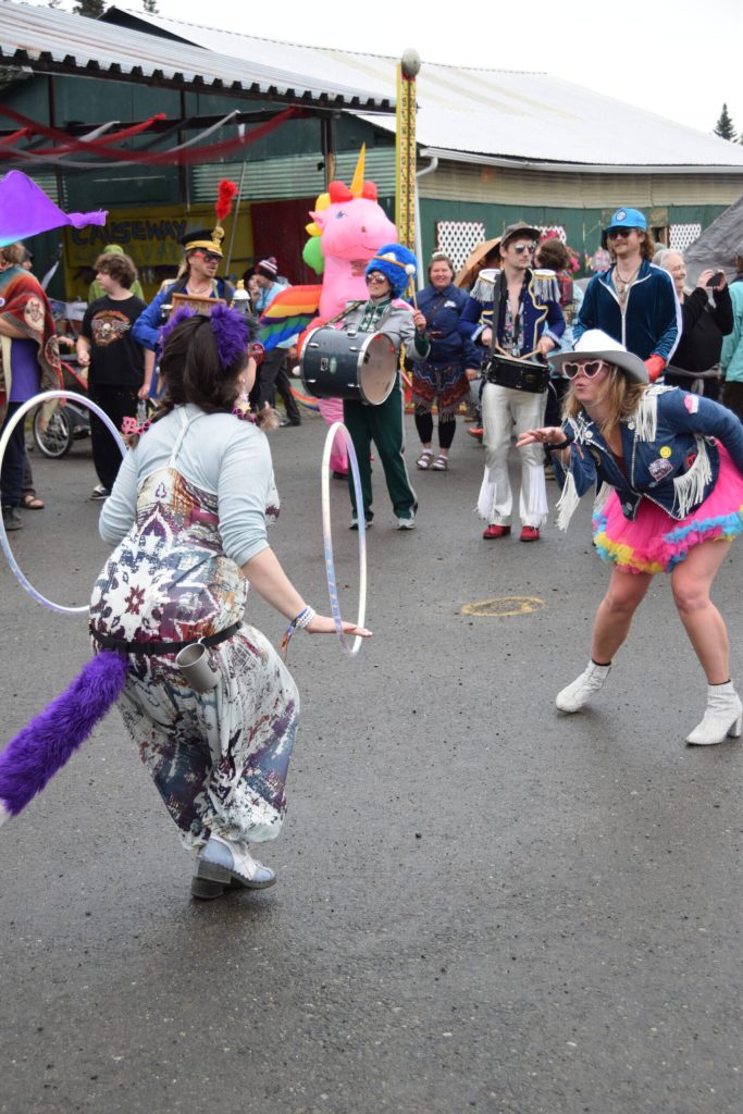 Members of the Parkstrippers Marching Band dance in the Causeway during Salmonfest on Saturday, Aug. 2, 2025, at the Kenai Peninsula Fairgrounds in Ninilchik, Alaska. (Delcenia Cosman/Homer News)