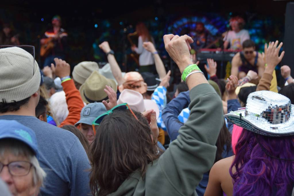 Salmonfest-goers dance on the lawn by the Ocean Stage during Blackwater Railroad Companys performance on Saturday, Aug. 2, 2025, at the Kenai Peninsula Fairgrounds in Ninilchik, Alaska. (Delcenia Cosman/Homer News)