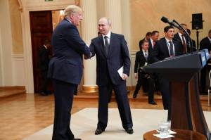 President Donald Trump shakes hands with President Vladimir Putin of Russia during a joint news conference in Helsinki, Finland, July 16, 2018. In the 2018 meeting, President Trump said he accepted President Vladimir Putins denial of election interference over the judgment of American intelligence agencies. (Doug Mills/The New York Times)