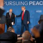 Russian President Vladimir Putin and President Donald Trump begin to leave the stage after making statements following their meeting in Anchorage, Aug. 15. After that meeting, Trump adopted Putins preference for pursuing a sweeping peace agreement that would require Ukraine to cede territory to Russia. (Doug Mills/The New York Times)