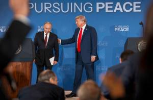 Russian President Vladimir Putin and President Donald Trump begin to leave the stage after making statements following their meeting in Anchorage, Alaska, Aug. 15, 2025. After that meeting, Trump adopted Putin’s preference for pursuing a sweeping peace agreement that would require Ukraine to cede territory to Russia. (Doug Mills/The New York Times)