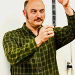 James Edens looks at 35mm film he had just developed. (Photo by By Jonathon Dawe/ Wrangell Sentinel)