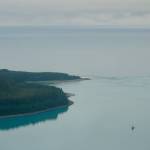 A ship enters Lituya Bay on the incoming tide in July, 2021. (Photo by Ned Rozell)
