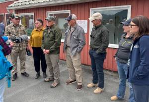 Members of the U.S. House Committee on Natural Resources talk with reporters at Juneau International Airport on Monday, Aug. 25, 2025. (Photo by James Brooks/Alaska Beacon)