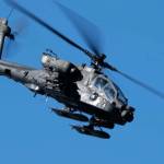 U.S. Army pilots engage opposing forces with the AH-64 Apache during the Arctic Thunder Open House at Joint Base Elmendorf-Richardson in Alaska on June 13, 2024. This is an example of the types of aircraft that will be transferring through the Yukon to stand up a new Combat Aviation Brigade in Alaska. (Spc. Brandon Vasquez/11th Airborne Division)