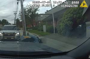Former Juneau Police Department Officer Brandon LeBlanc is seen throwing a man to the sidewalk in dash-camera footage from another officers patrol car outside the Douglas Public Library in Douglas, Alaska, on July 30, 2025. (Provided by Juneau Police Department)