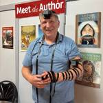 Photo provided by Alexander Dolitsky
Alexander Dolitsky participates in a traditional Jewish blessing, in which two leather boxes (tefillins) are secured around a persons head and arm, at Hearthside Books in the Merchant Wharf Mall in downtown Juneau, August 2025.