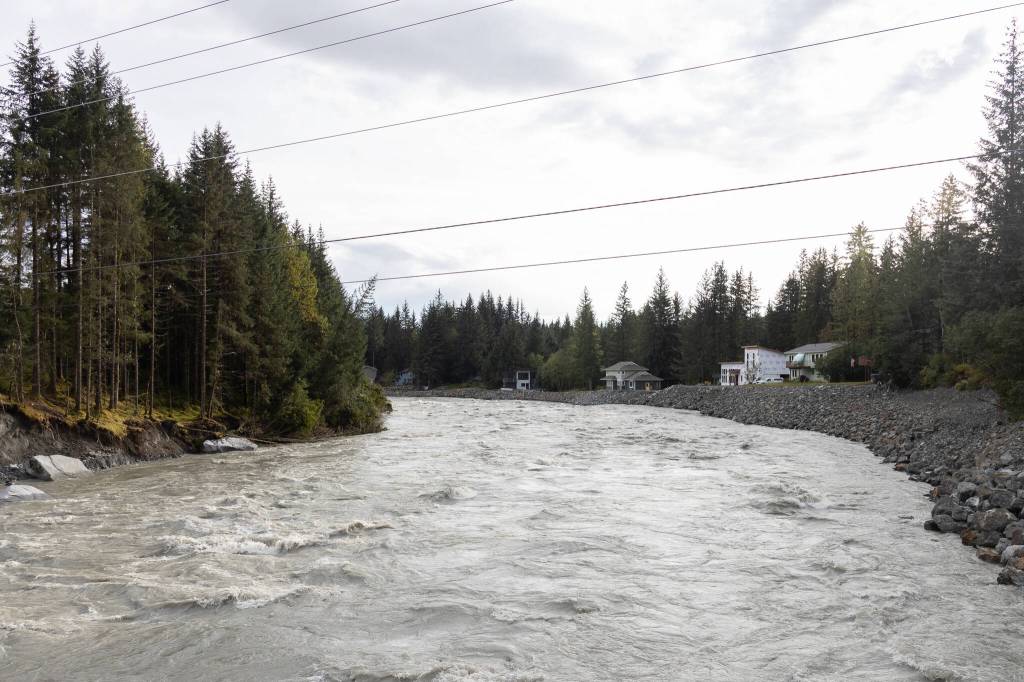 Homes along the Mendenhall River are pictured from Back Loop Bridge on Sept. 15, 2025, in Juneau, Alaska. (Chloe Anderson/Juneau Empire)