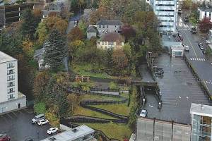 The Edward Webster House (top center in grey), named for a former owner who located his Juneau and Douglas Telephone Co. there for decades beginning in 1915, is the oldest house still in use in Juneau. (Photo courtesy of the City and Borough of Juneau)