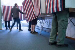In this Nov. 6, 2018 photo, voters fill the voting booths at Glacier Valley Baptist Church on Election Day. (Michael Penn | Juneau Empire File)
