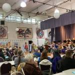 Todd Hunt introduces The Circle at Juneau Community Bands 2023 Oktoberfest concert. The score for the alphorns was composed specially the concert by Juneau composer Spencer Edgers. (Photo courtesy JCB President Sarah McNair-Grove)
