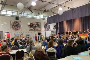 Todd Hunt introduces The Circle at Juneau Community Bands 2023 Oktoberfest concert. The score for the alphorns was composed specially the concert by Juneau composer Spencer Edgers. (Photo courtesy JCB President Sarah McNair-Grove)
