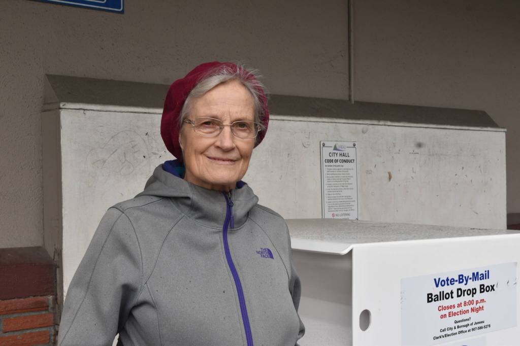 Terry Hoskinson stands aside ballot drop box after voting. (Mari Kanagy / Juneau Empire)