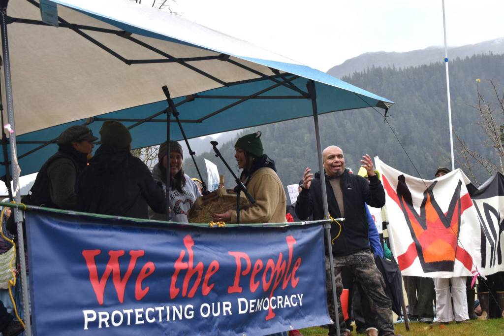 Xeetli.éesh Lyle James leads his family in a drumming and song performance at the No Tsars, No Kings protest on Saturday, Oct. 18. (Mari Kanagy/Juneau Empire)