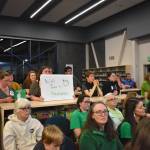 Members of Juneau Education Association and supporters of the union dress in green at the Board of Education Meeting on Oct. 28, 2025. (Mari Kanagy/Juneau Empire)