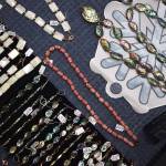 Jewelry lays on display at Tlaangunk Renee Culp and Duné Kathy Rados booth, Sugar Bear Alaskan Treasures, at the Juneau Public Market on Friday, Nov. 28. (Mari Kanagy /Juneau Empire)