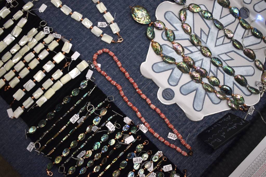 Jewelry lays on display at Tlaangunk Renee Culp and Duné Kathy Rados booth, Sugar Bear Alaskan Treasures, at the Juneau Public Market on Friday, Nov. 28. (Mari Kanagy /Juneau Empire)