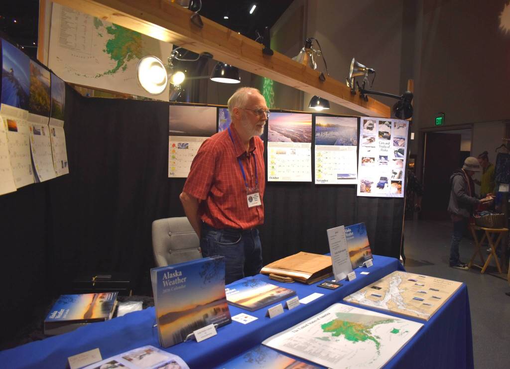 Meteorologist Jim Green presented his weather calendars and maps at the Juneau Public Market on Friday, Nov. 28. (Mari Kanagy /Juneau Empire)