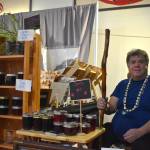 Michael Wilson of Keet Enterprises offers devils club staffs and salves and more at the Juneau Public Market on Friday, Nov. 28. (Mari Kanagy /Juneau Empire)