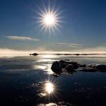 Lisa Hupp/USFWS
The sun at midnight in early July reflects on the Chukchi Sea and slabs of sea ice near the coastline of Utgiagvik.